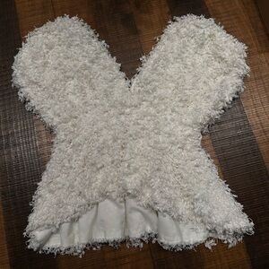 Popcorn textured baby doll top with a V neckline